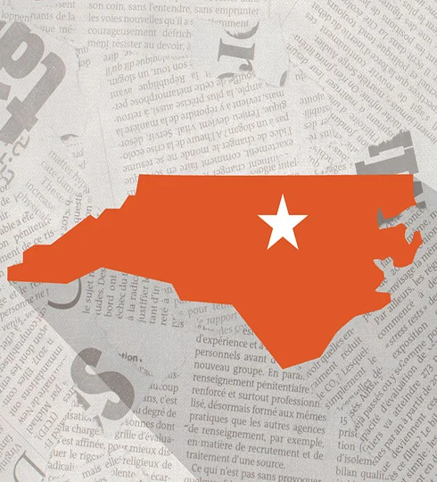 Orange North Carolina state map showing a white star over Raleigh