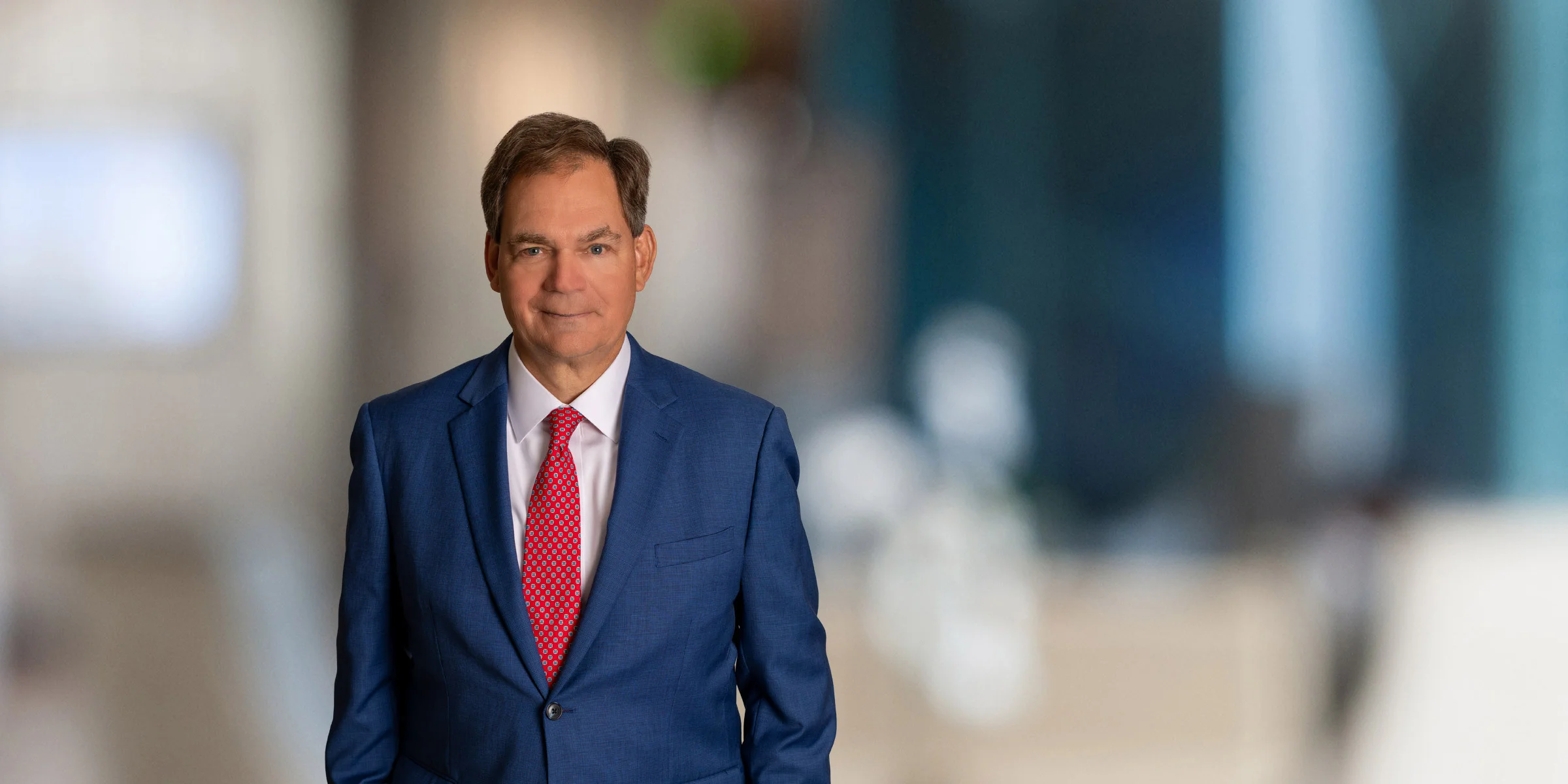 Smiling Greg Davis in a suit