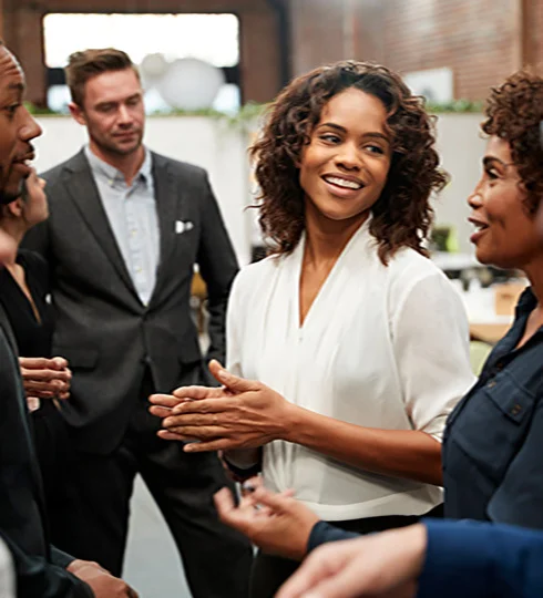 Woman smiling while talking to other people