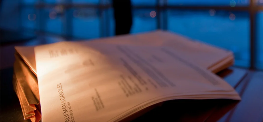 Kaufman & Canoles logo at the top of a piece of paper