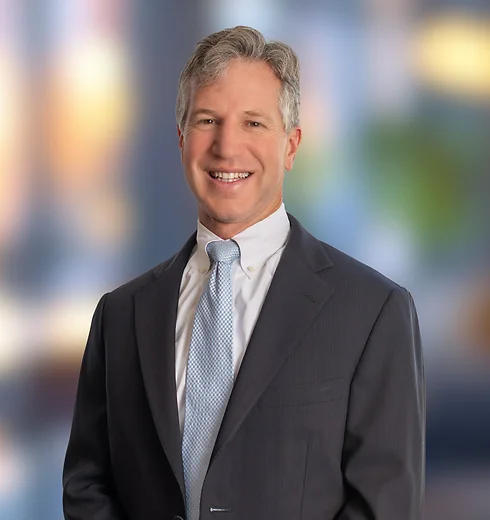 Timothy Trant in dark suit and blue tie