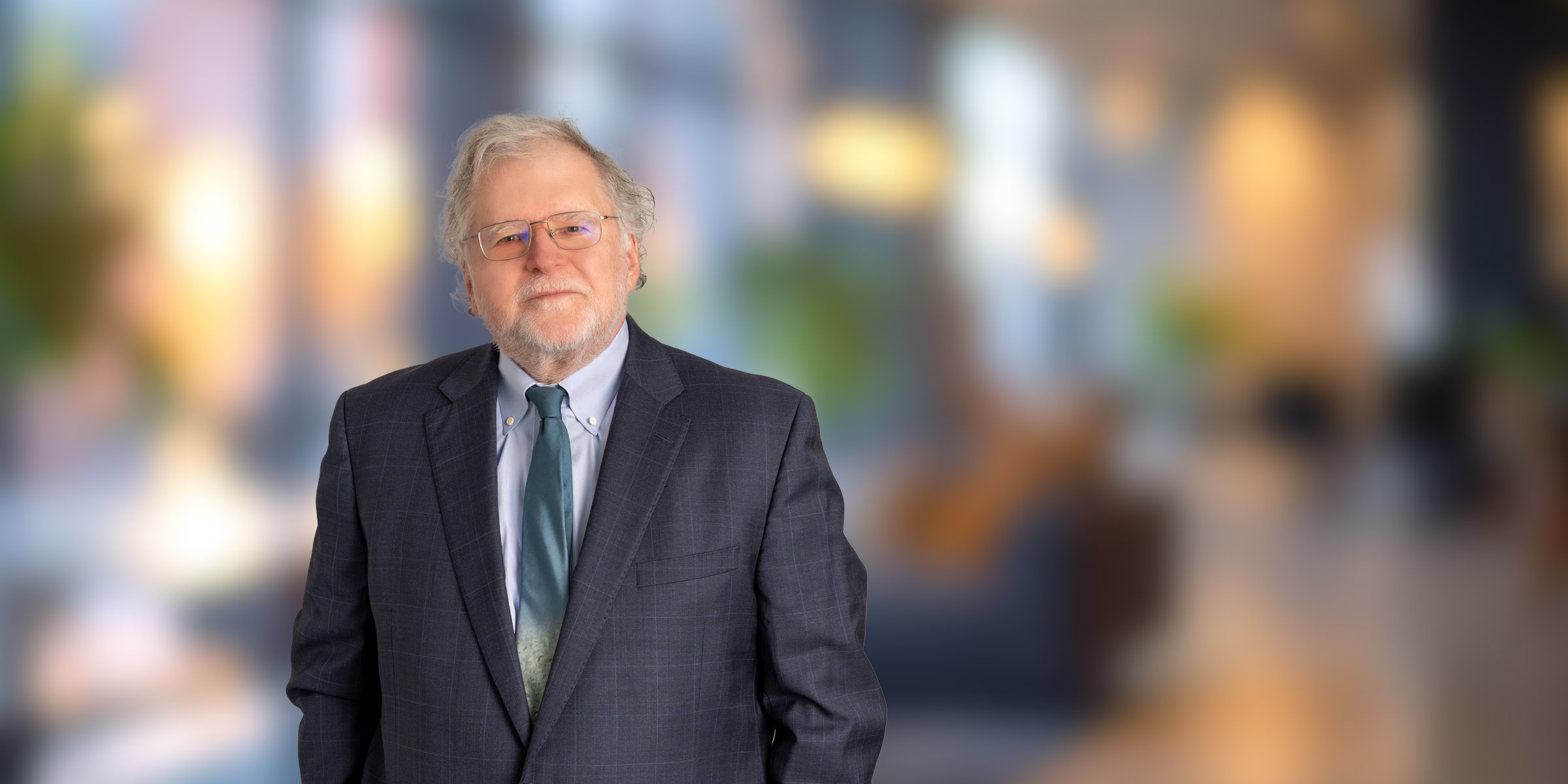 John Bredehoft in dark suit with green tie