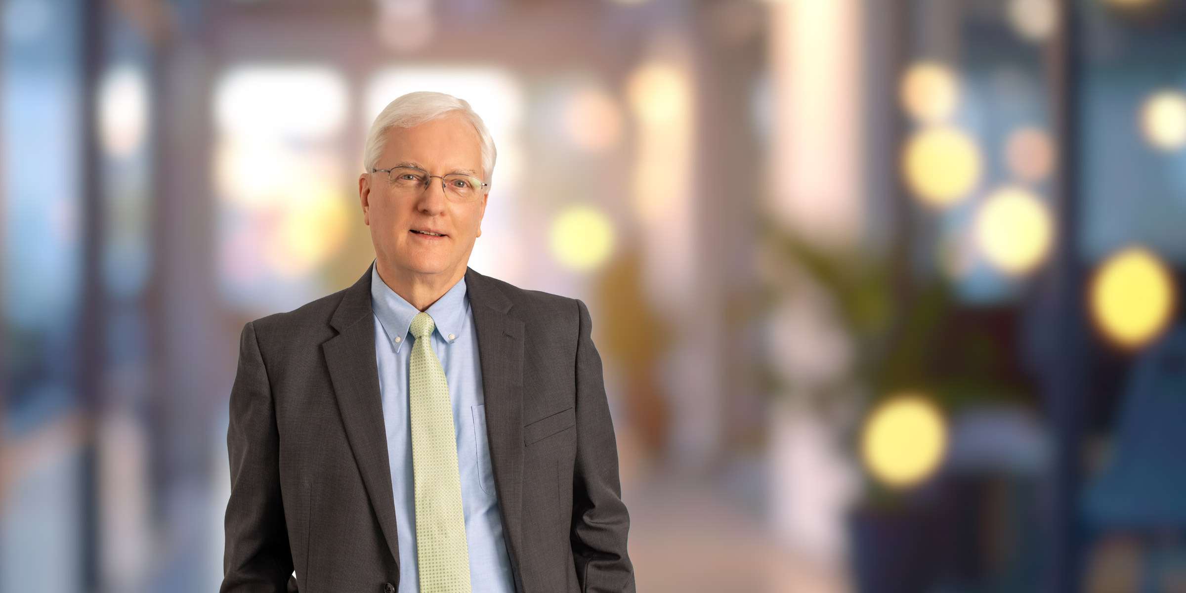 Barry Hunter in dark suit and yellow tie