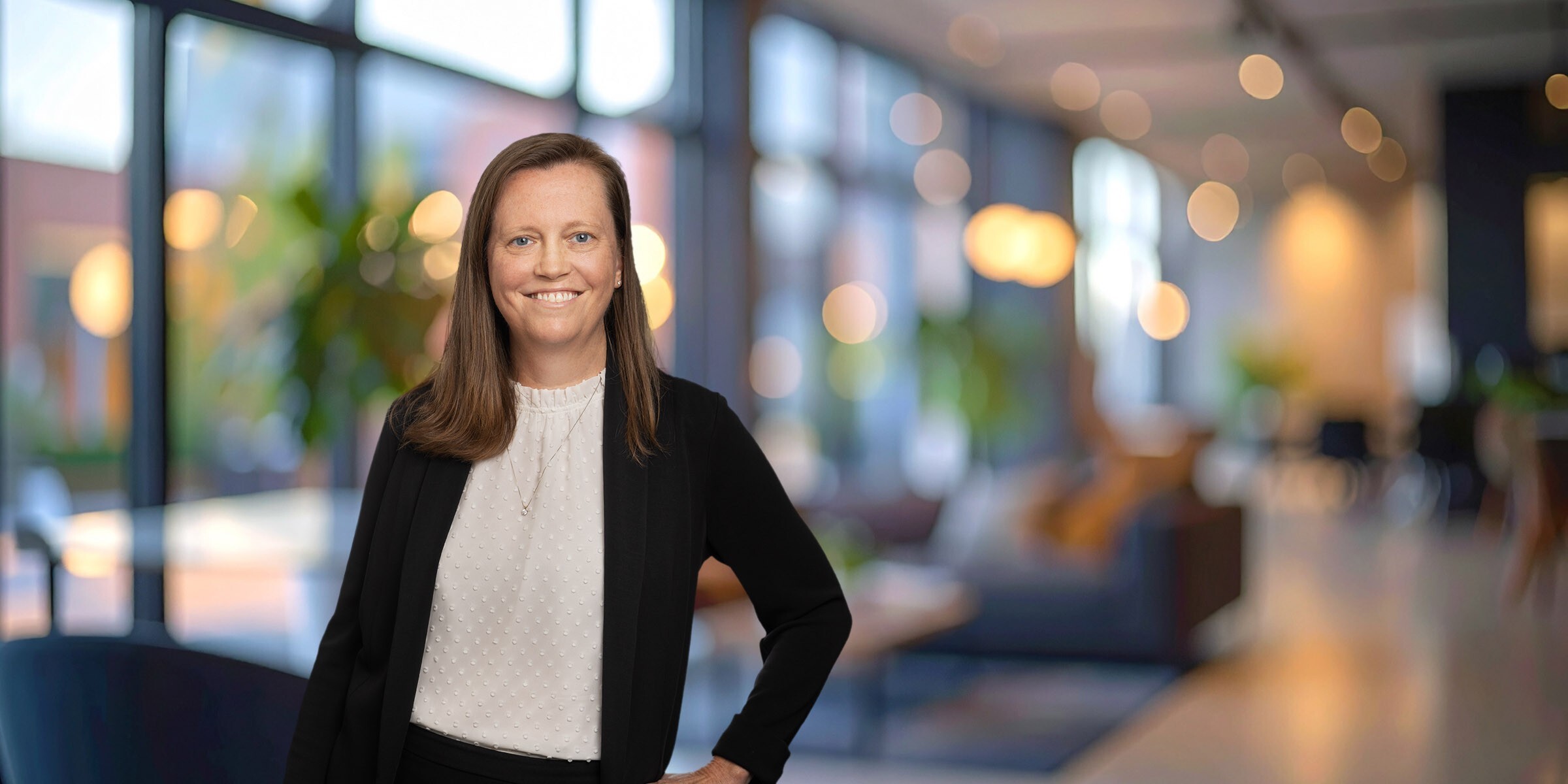 Megan Gilliland in a black suit with a white shirt