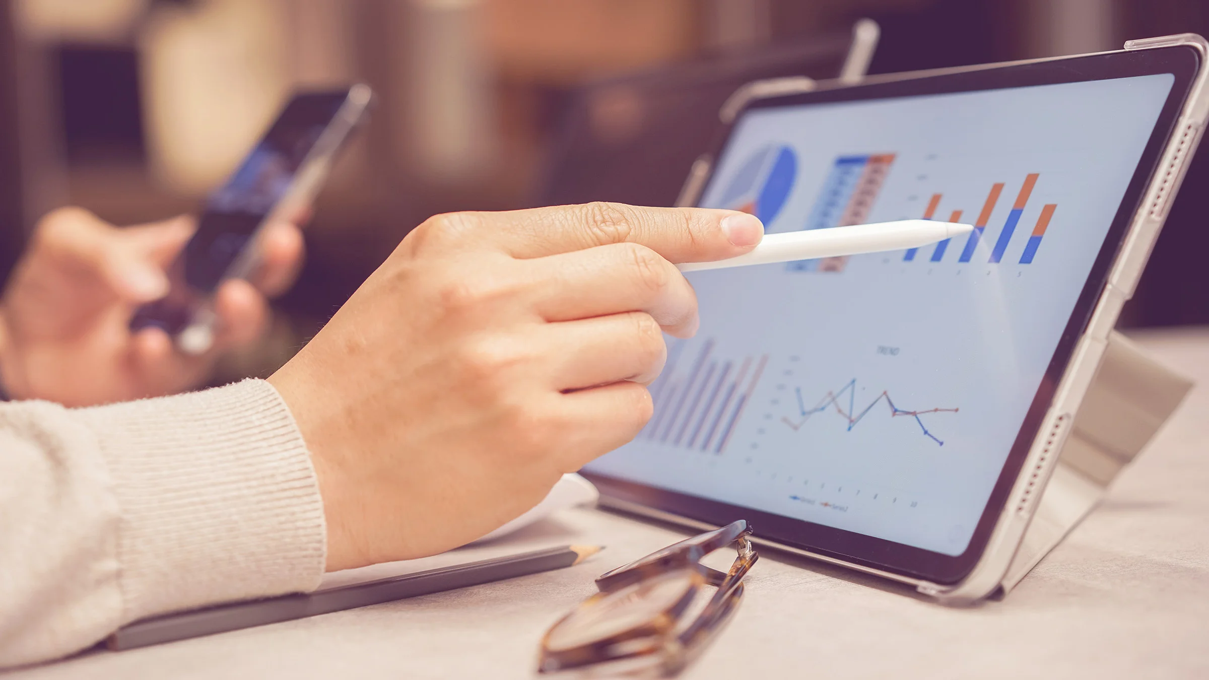 Tablet and phone on conference table