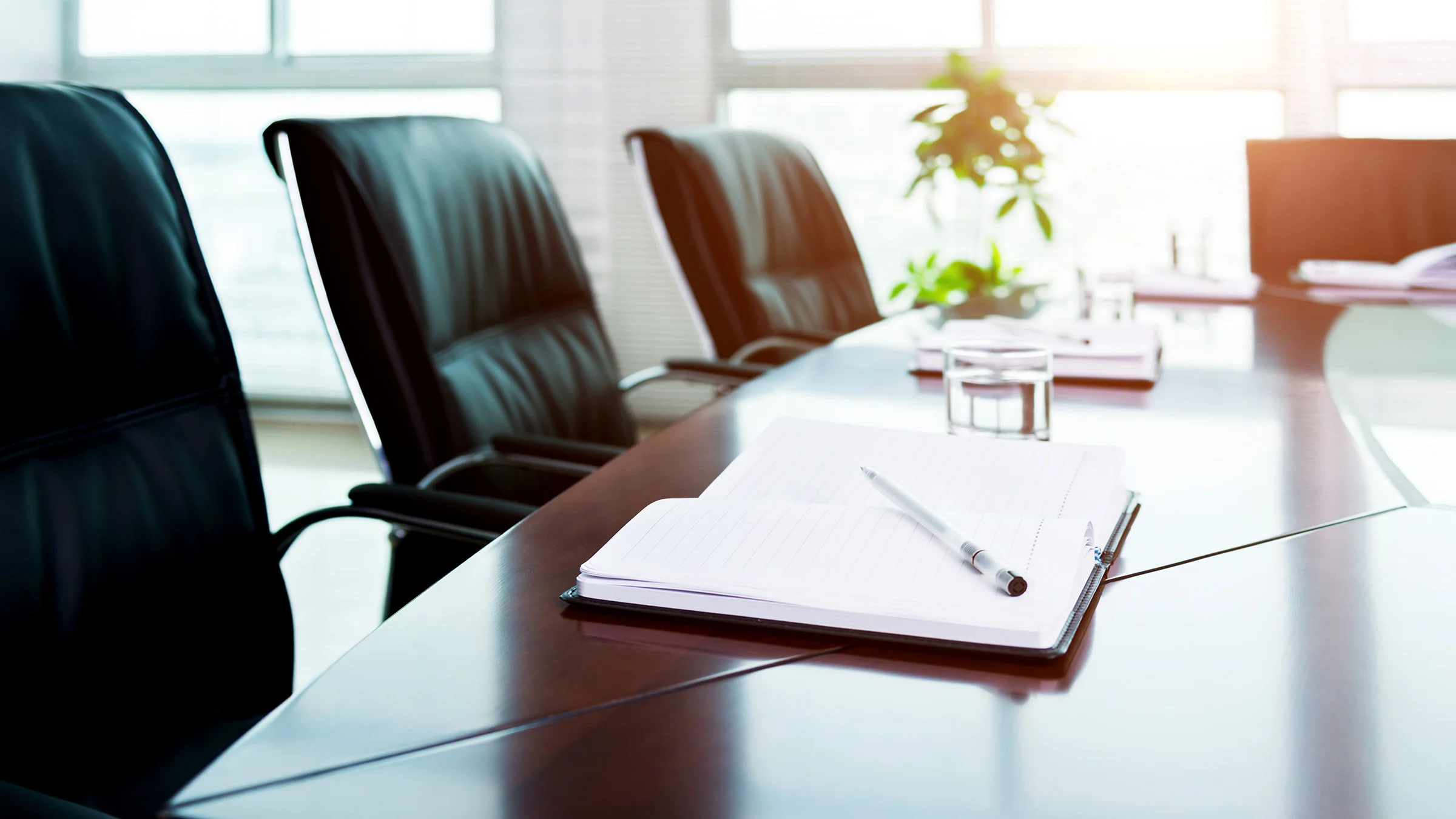 Chairs around an empty conference table