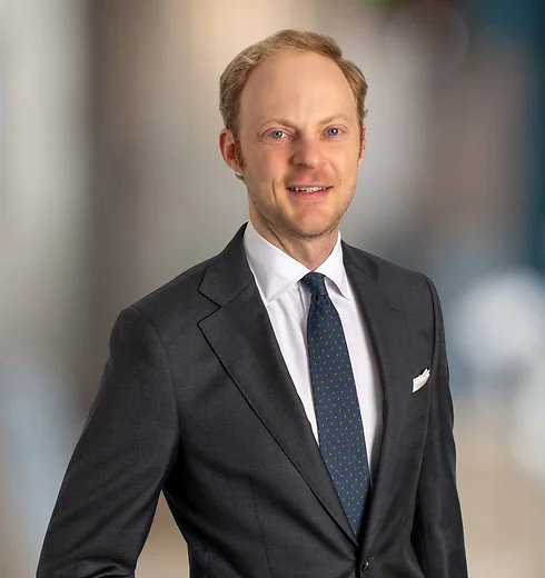 Ben Korte standing in a suit