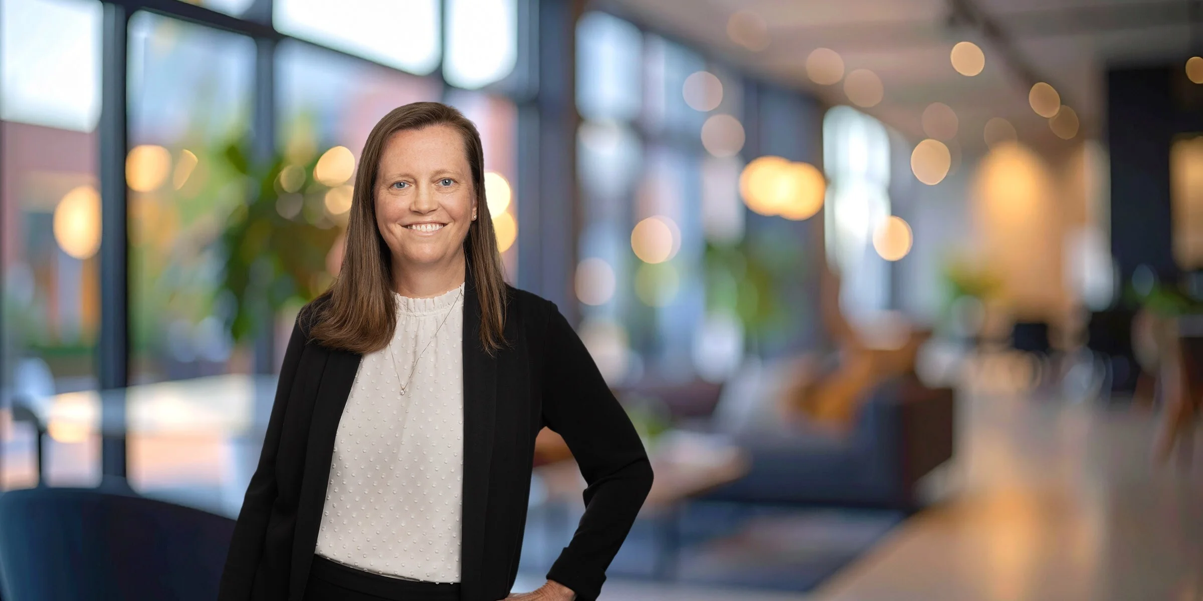 Megan Gilliland in a black suit with a white shirt