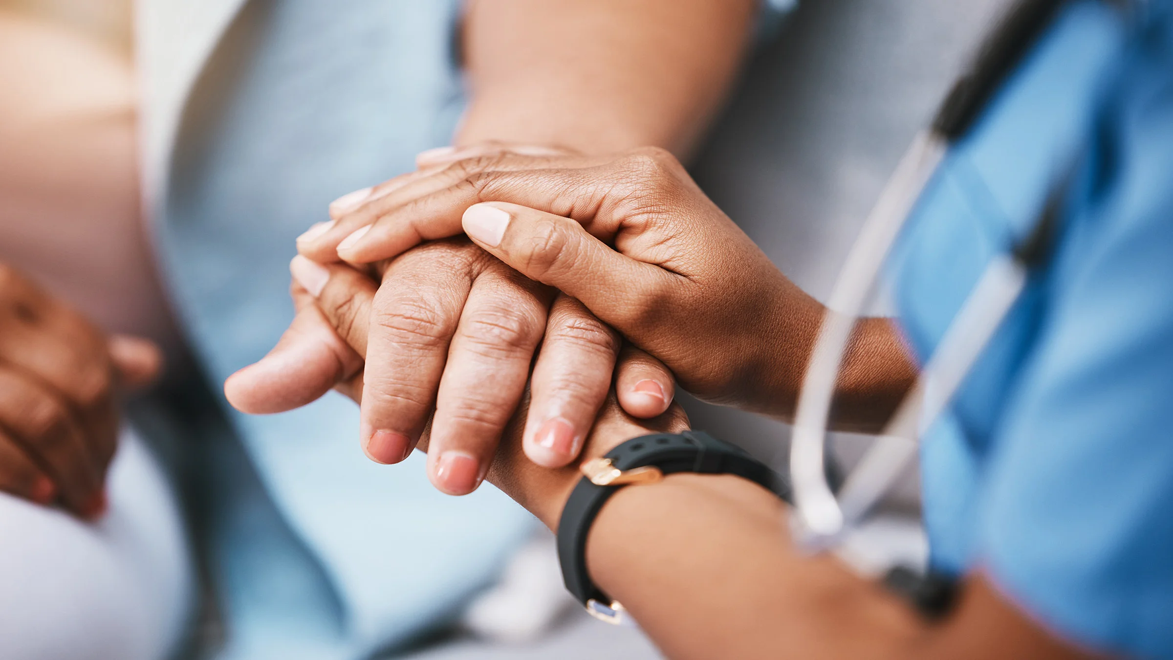 Doctor holding patient's hand