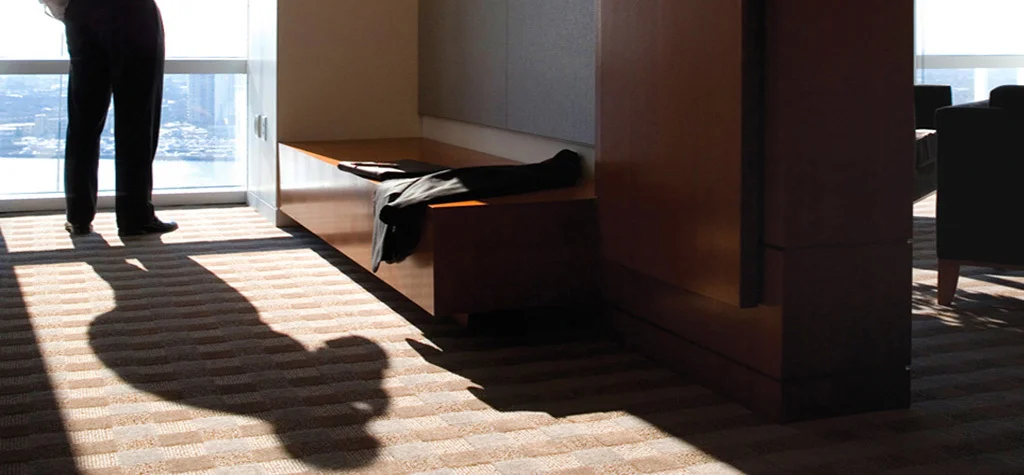Shadow of man standing near window
