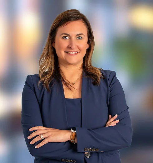 Lauren Kadish in a suit with her arms crossed