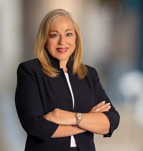 Vonda Chappell with her arms crossed in a black jacket
