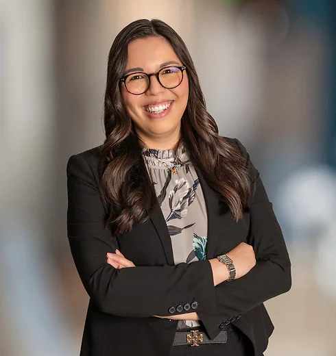 Samantha Forsyth in black suit jacket and patterned blouse