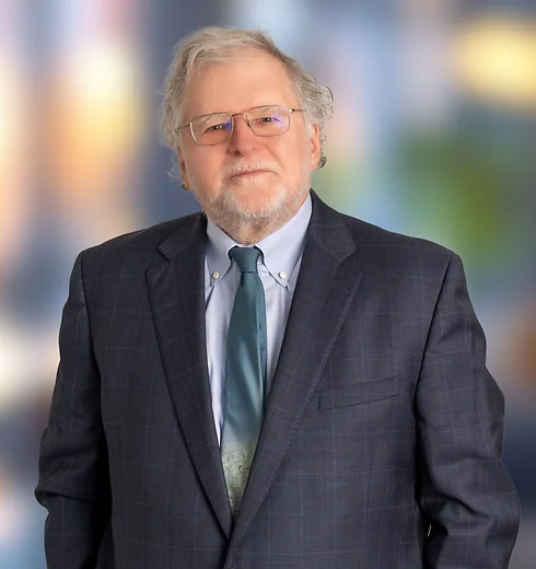 John Bredehoft in dark suit with green tie
