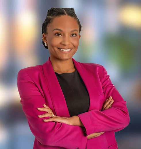 Smiling Lauren Jones in a bright pink business suit