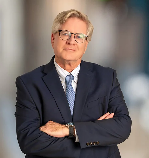 Patrick O'Donnell in navy suit and blue tie