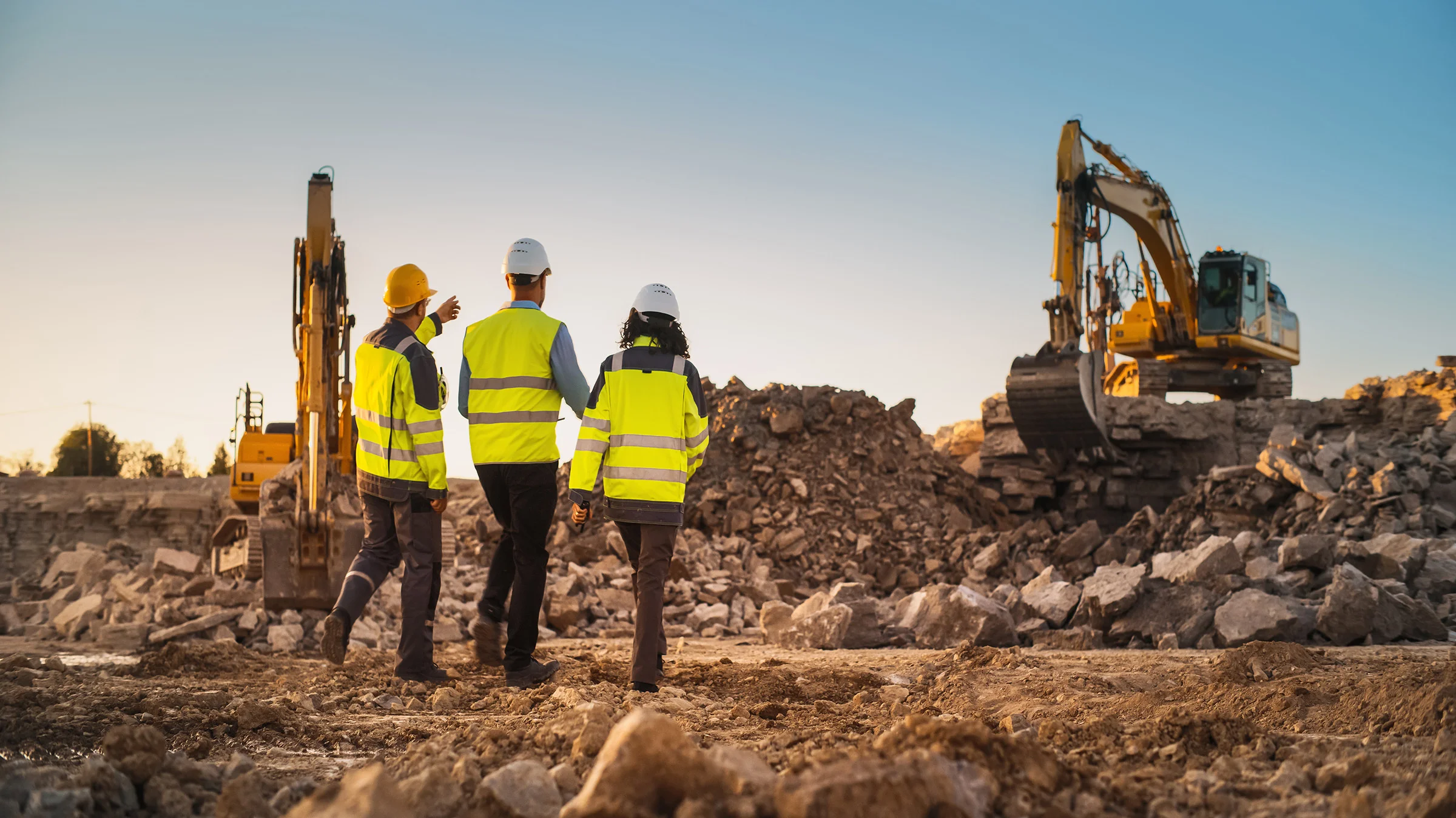 3 construction workers on a construction site