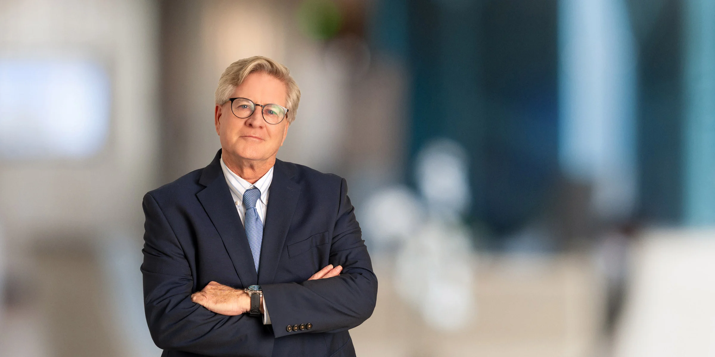 Patrick O'Donnell in navy suit and blue tie