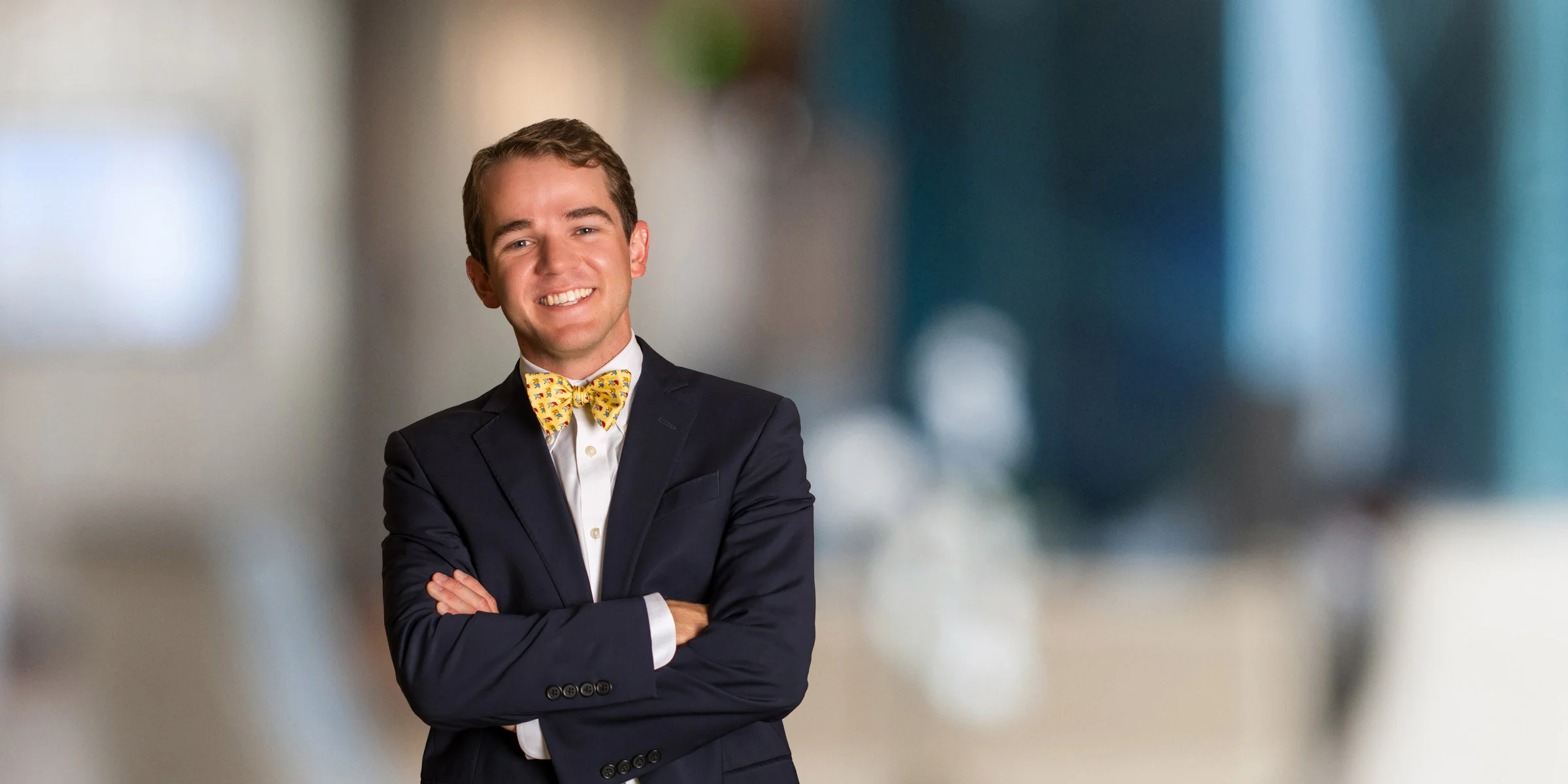 John Pittman in a dark suit and yellow bowtie
